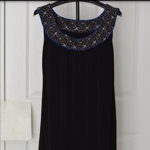 Women’s evening dress with fancy trims. (Sample)